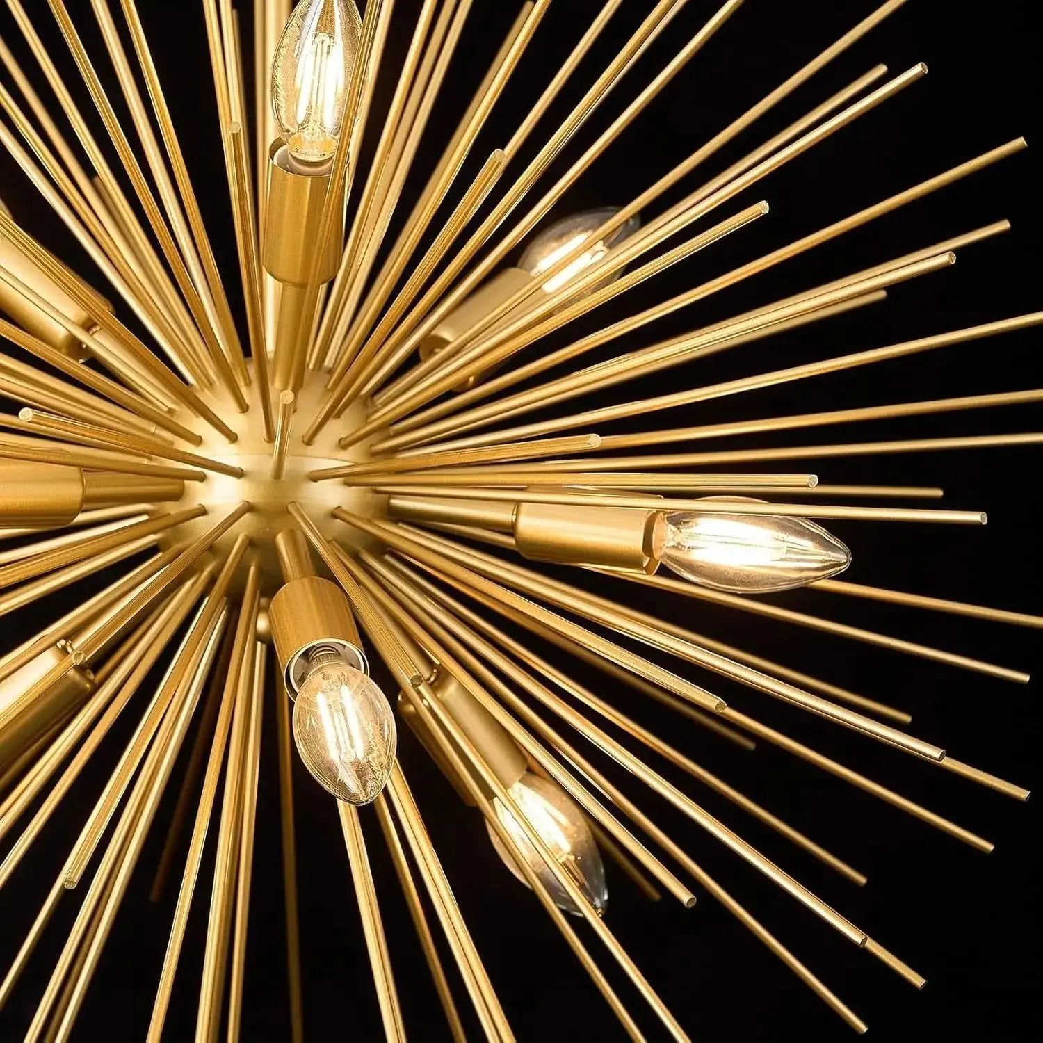 Gold sputnik chandelier with multiple light bulbs on a black background