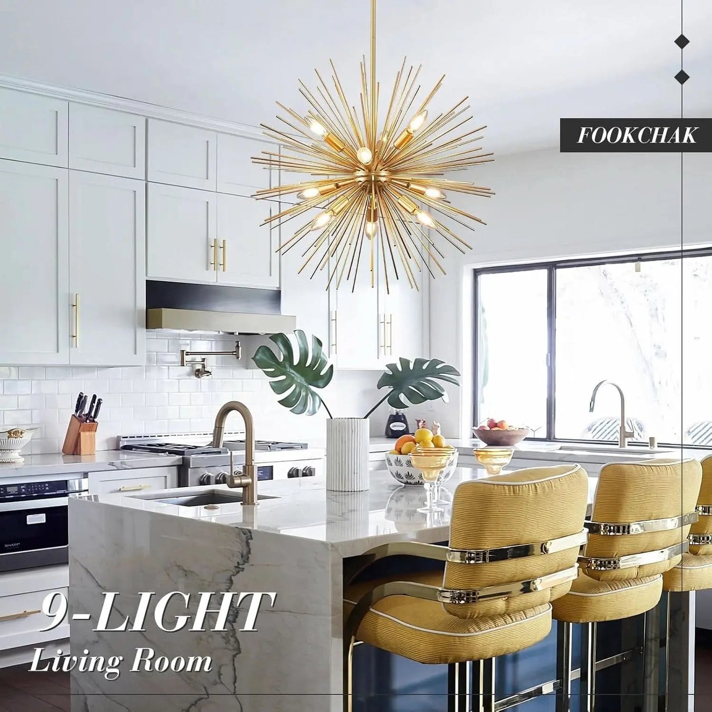 Modern kitchen with a gold chandelier, marble island, and yellow chairs.