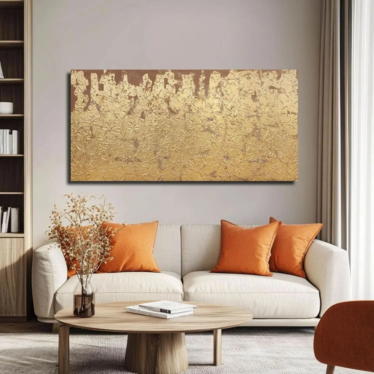 Living room with a beige sofa, wooden coffee table, and gold abstract painting on the wall.