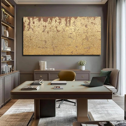Modern office with a large gold abstract painting on the wall, a desk, and chairs.