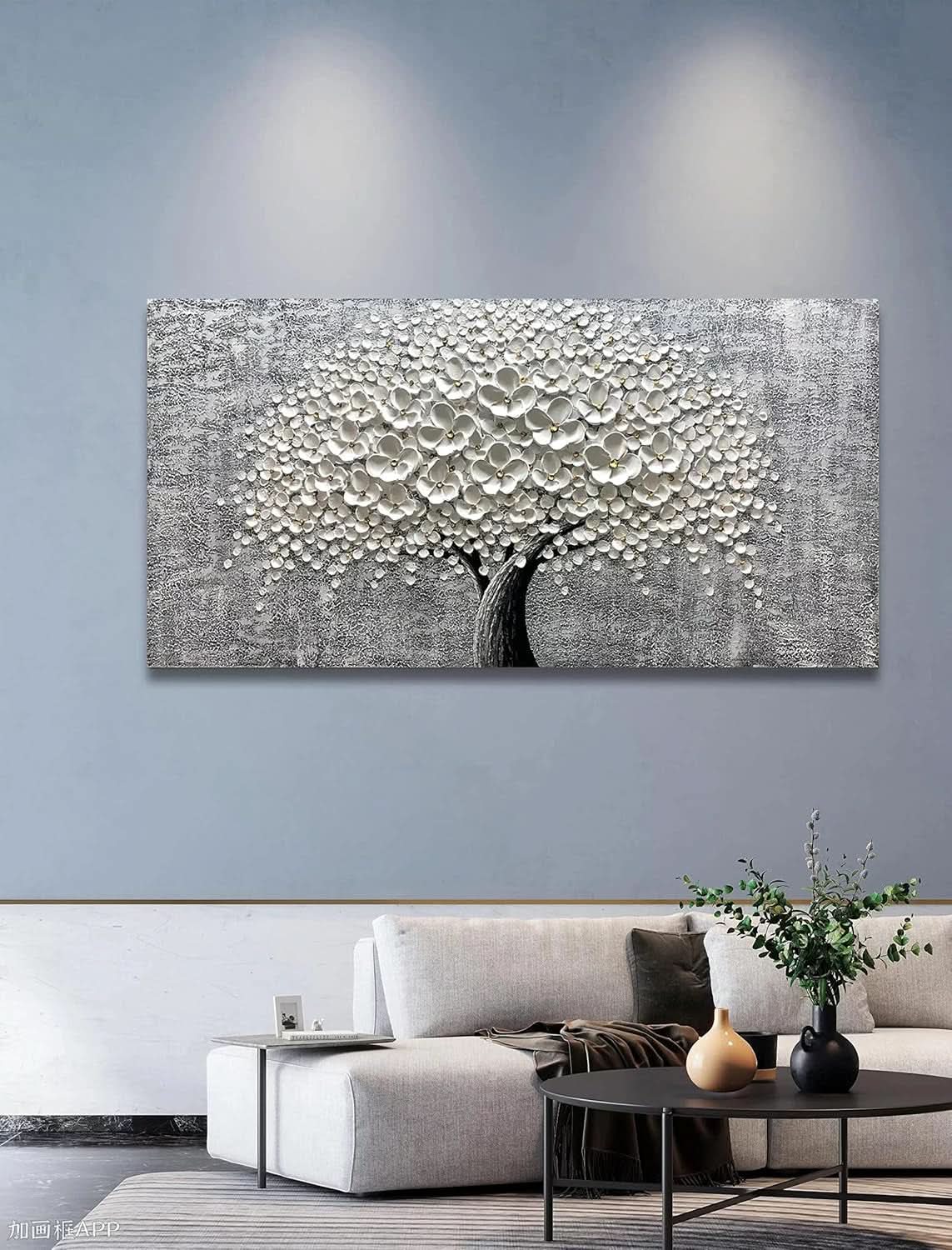 Abstract wall art in a living room with a sofa and coffee table.