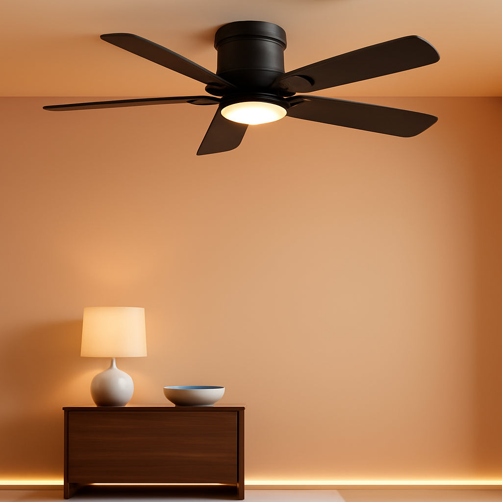 Ceiling fan with light fixture in a room with a lamp and bowl on a table.