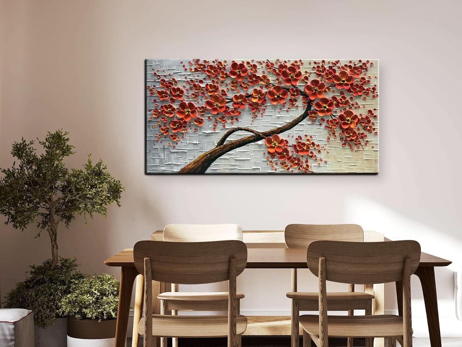 Dining room with a large abstract painting of red flowers on a wall above a wooden table.
