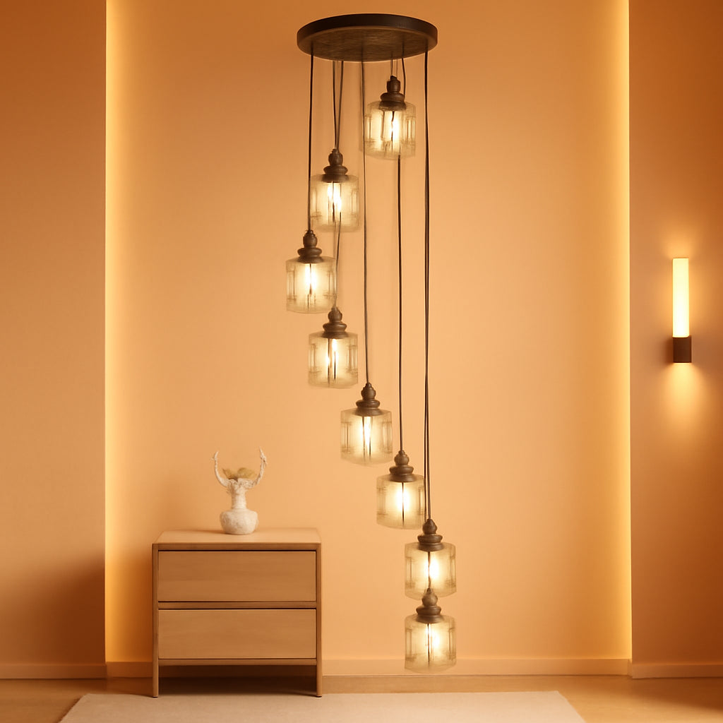 Modern chandelier with glass shades in a warm-toned room.