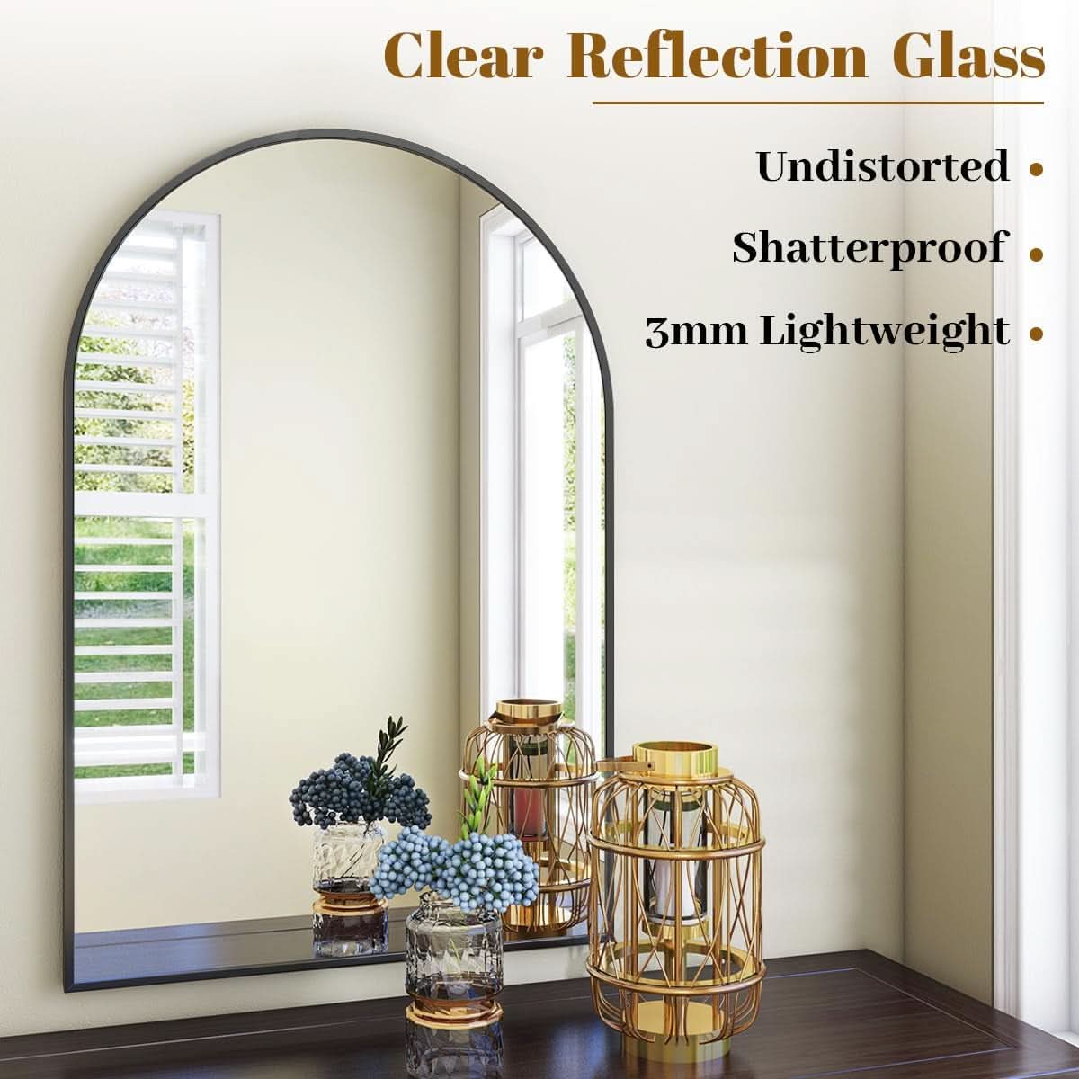 Arched mirror with decorative items on a shelf against a white wall
