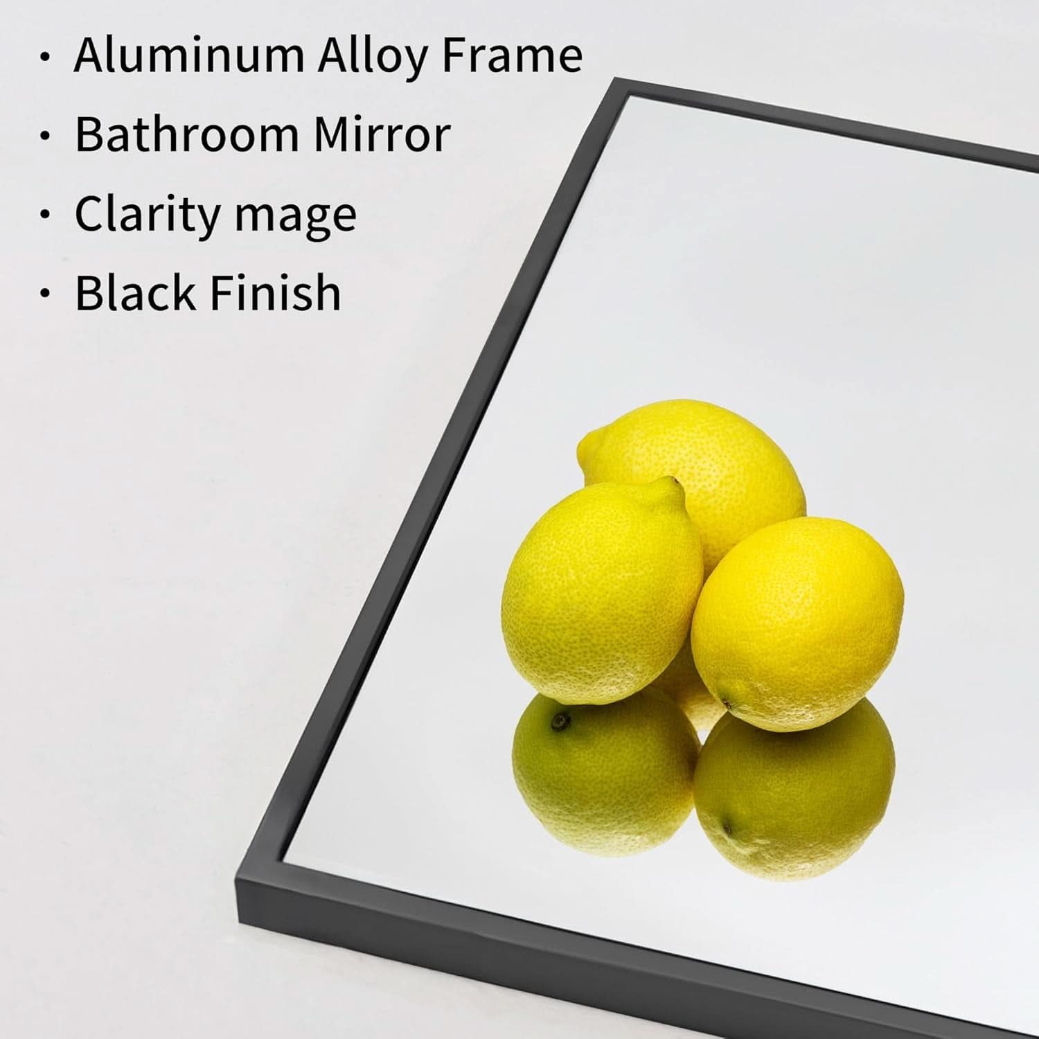 Bathroom mirror with black frame featuring lemons on a white background