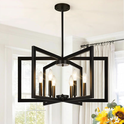 Black modern chandelier hanging in a room with white walls and a window.