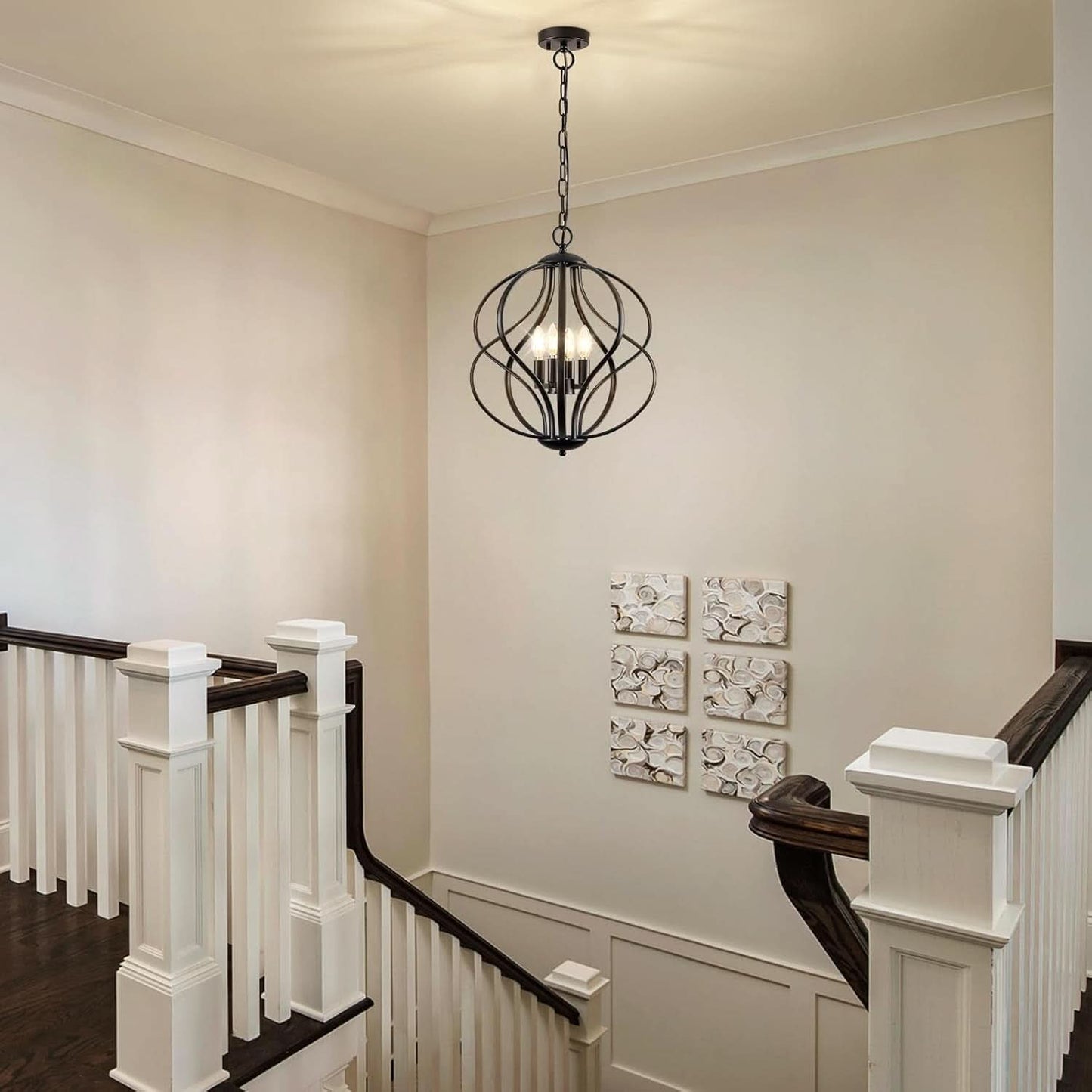 Foyer with a decorative ceiling light fixture and wall art