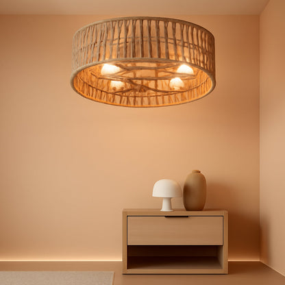 Ceiling light fixture in a room with a wooden side table and decorative items.
