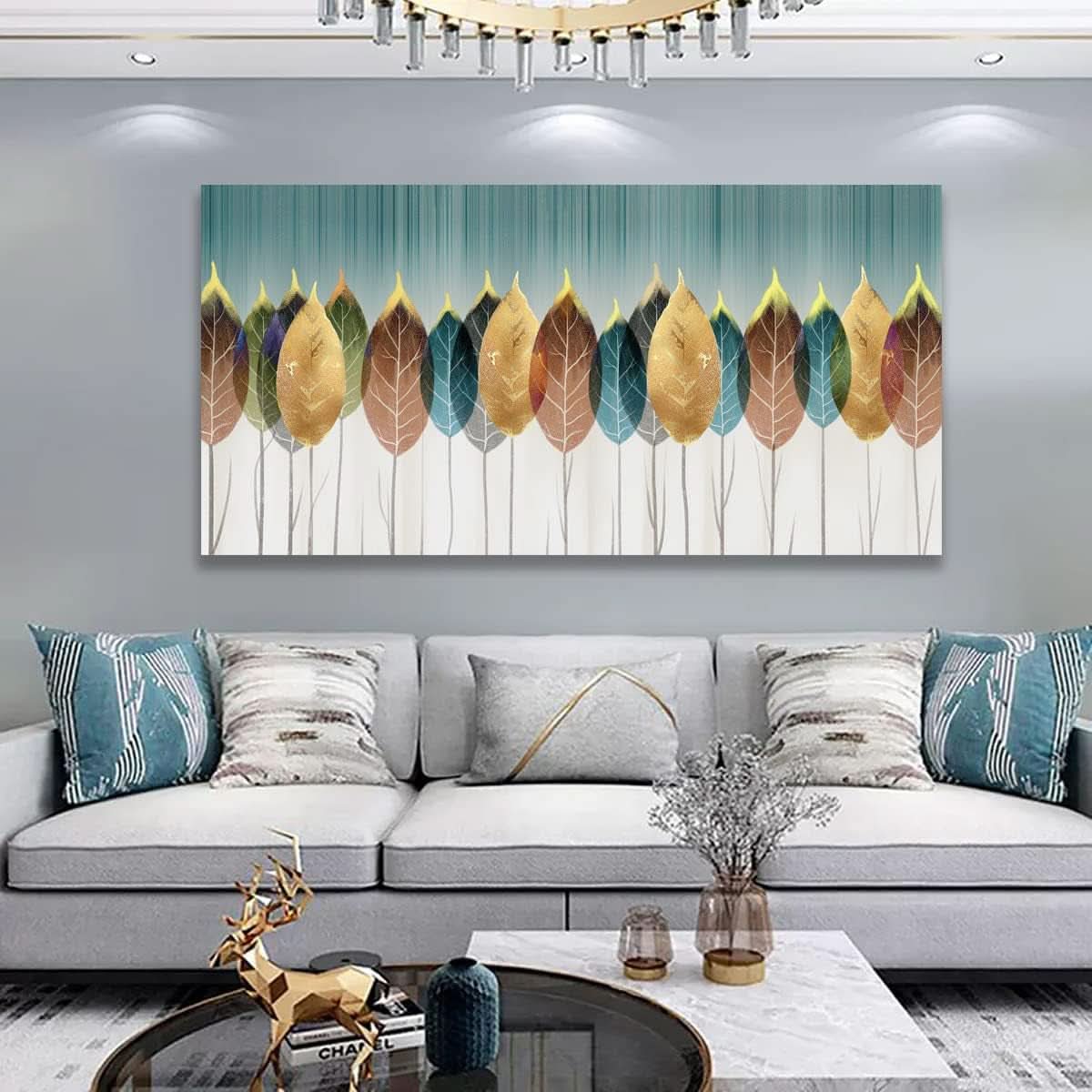 Living room with a large abstract leaf painting on the wall above a gray sofa.