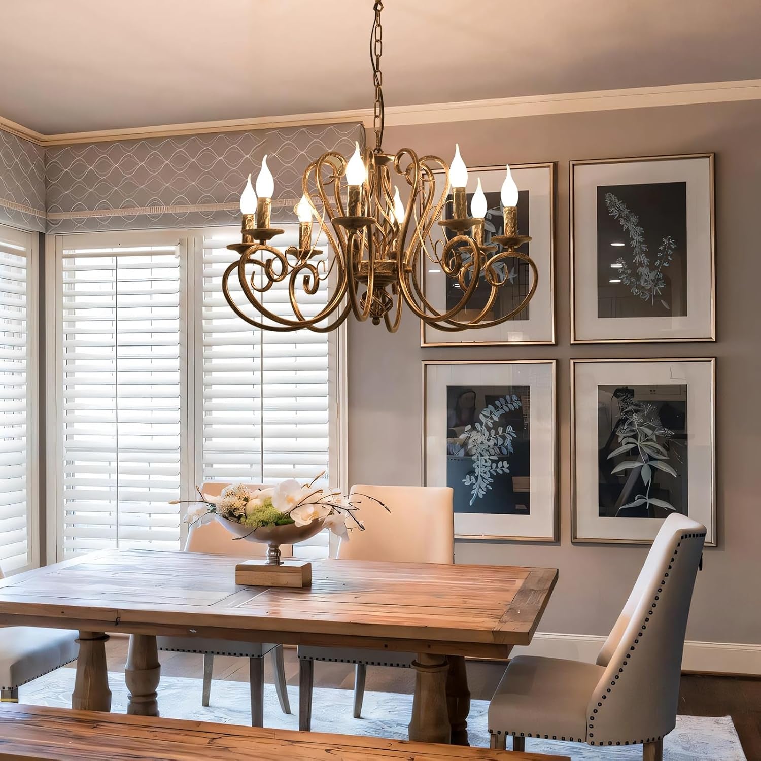 Dining room with wooden table, chairs, and a chandelier.