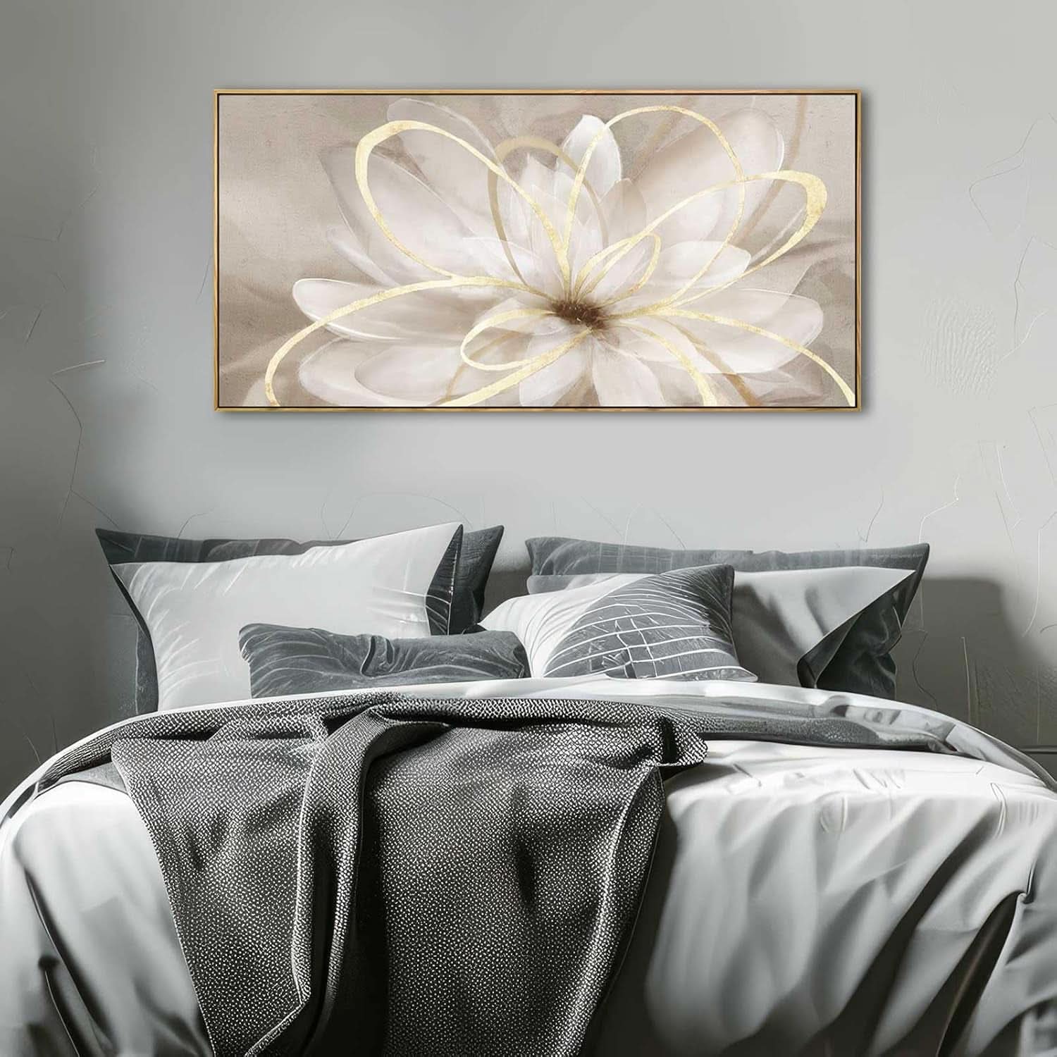 Floral artwork above a bed with gray bedding