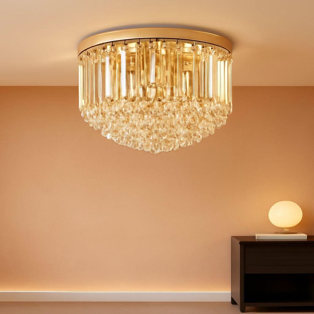 Chandelier hanging on a wall with a lamp on a table in the background