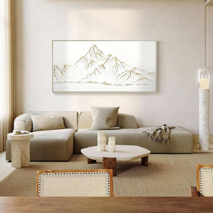 Modern living room with a beige sectional sofa, coffee table, and mountain-themed artwork on the wall.