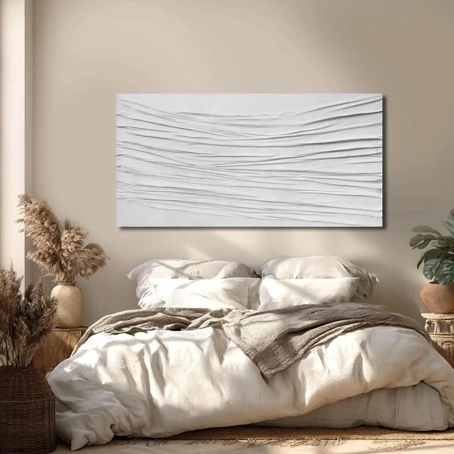 Abstract wall art above a bed in a bedroom setting